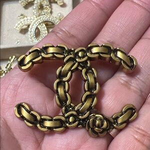 Elegant Gold and Black Chain Brooch